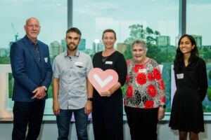 The Queensland Gives Panel - left to right Bob McCosker OAM, James teh, Rebecca Levingston holding a red heart, Maureen Stevenso and Famin Ahmed